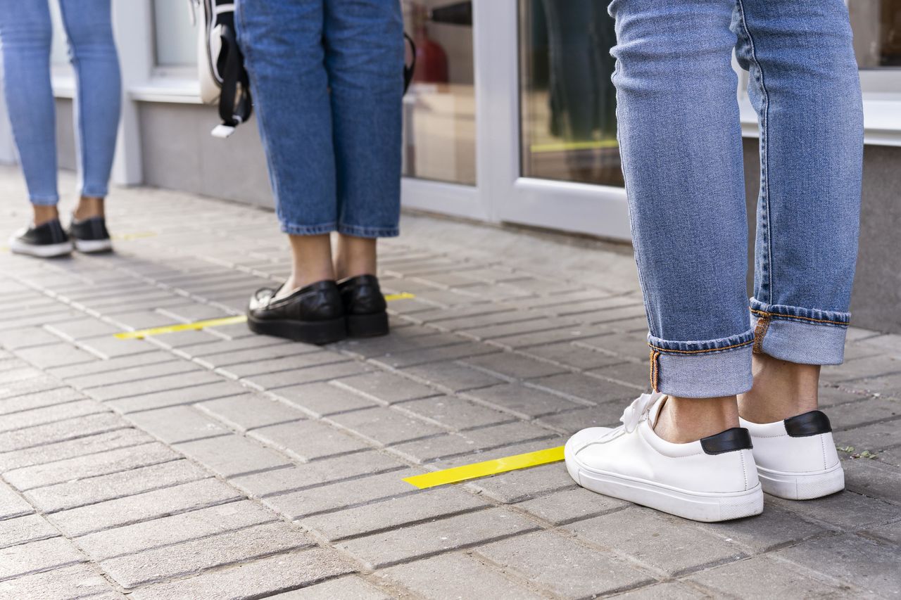 low section of man walking on street