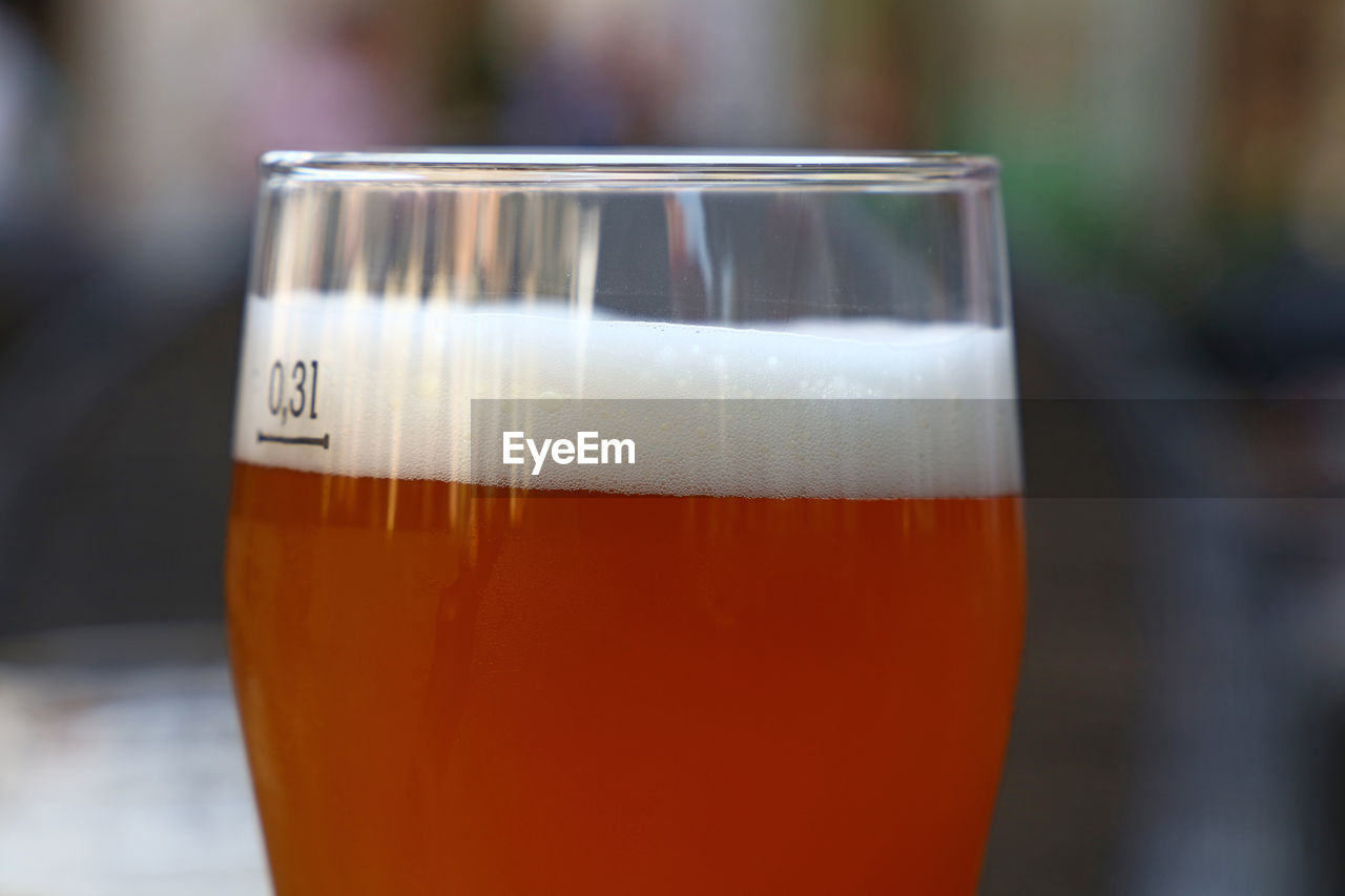 Close-up of draught beer on table