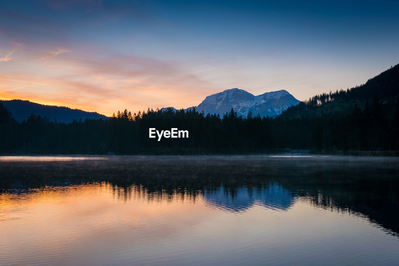 SCENIC VIEW OF LAKE BY TREES AGAINST SKY