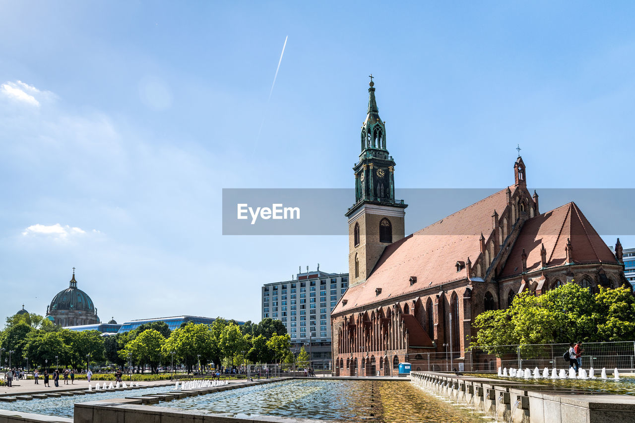 View of buildings in city against sky