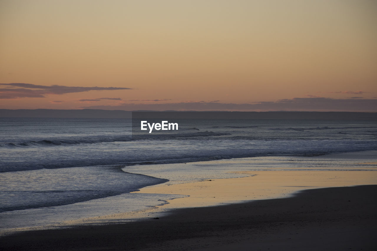 SCENIC VIEW OF SEA DURING SUNSET
