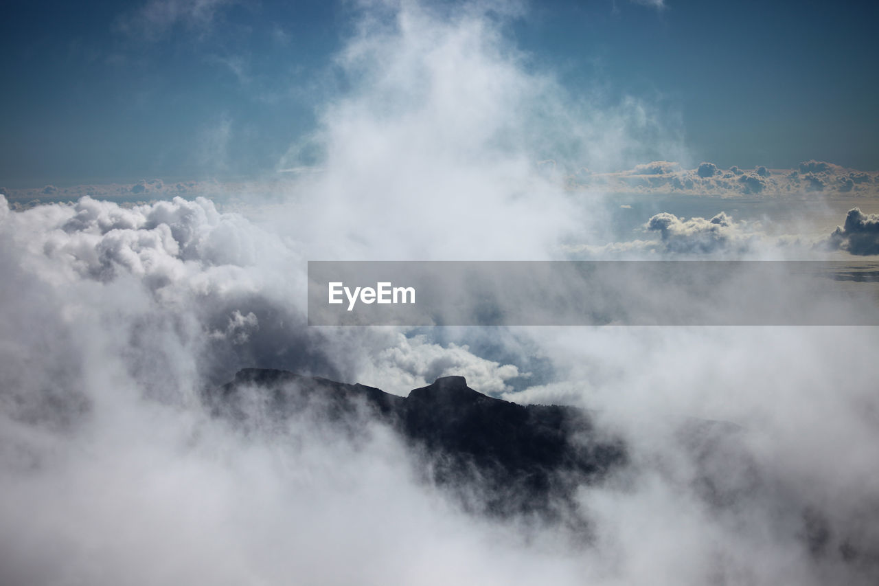 Scenic view of volcanic mountain against sky