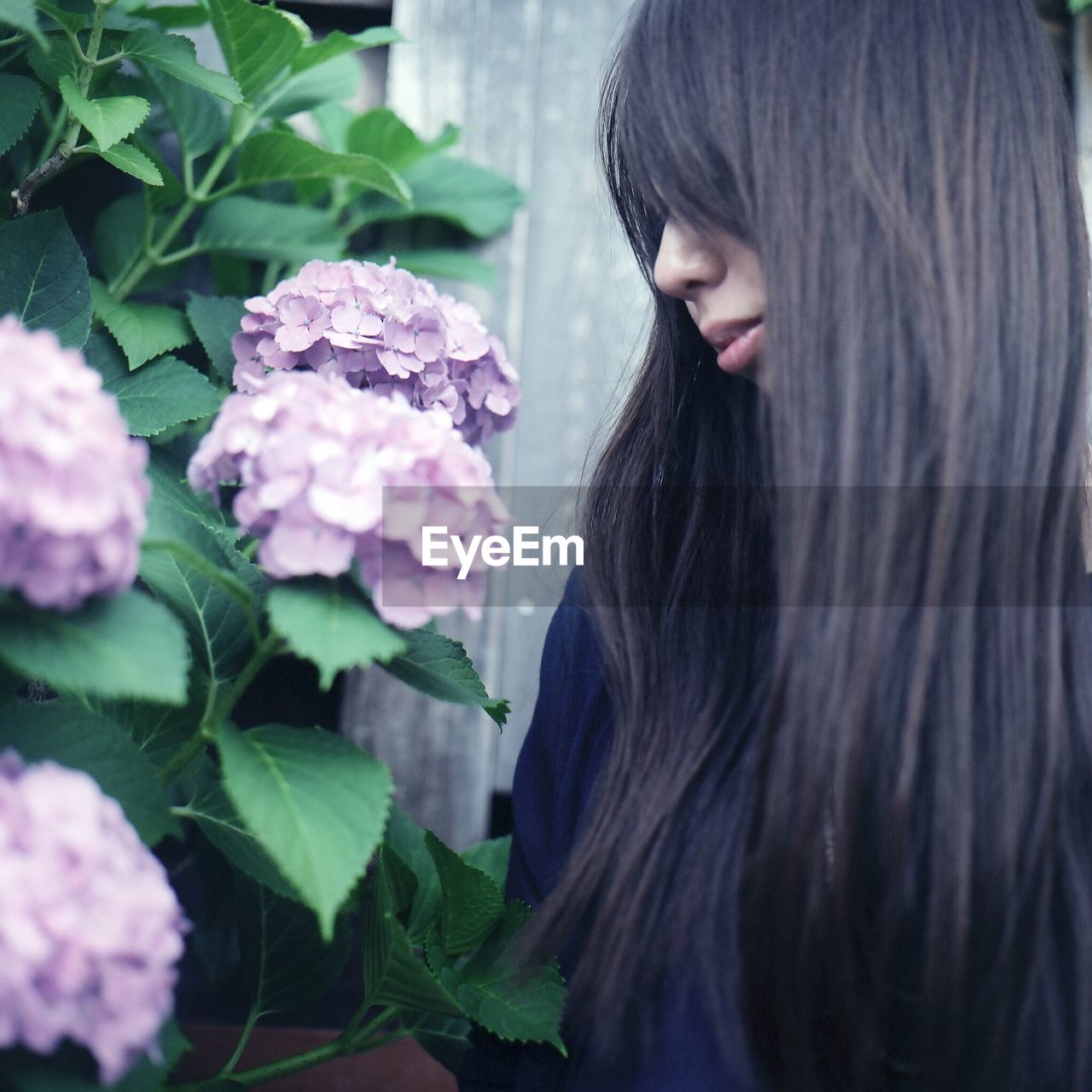 Woman looking at flowers