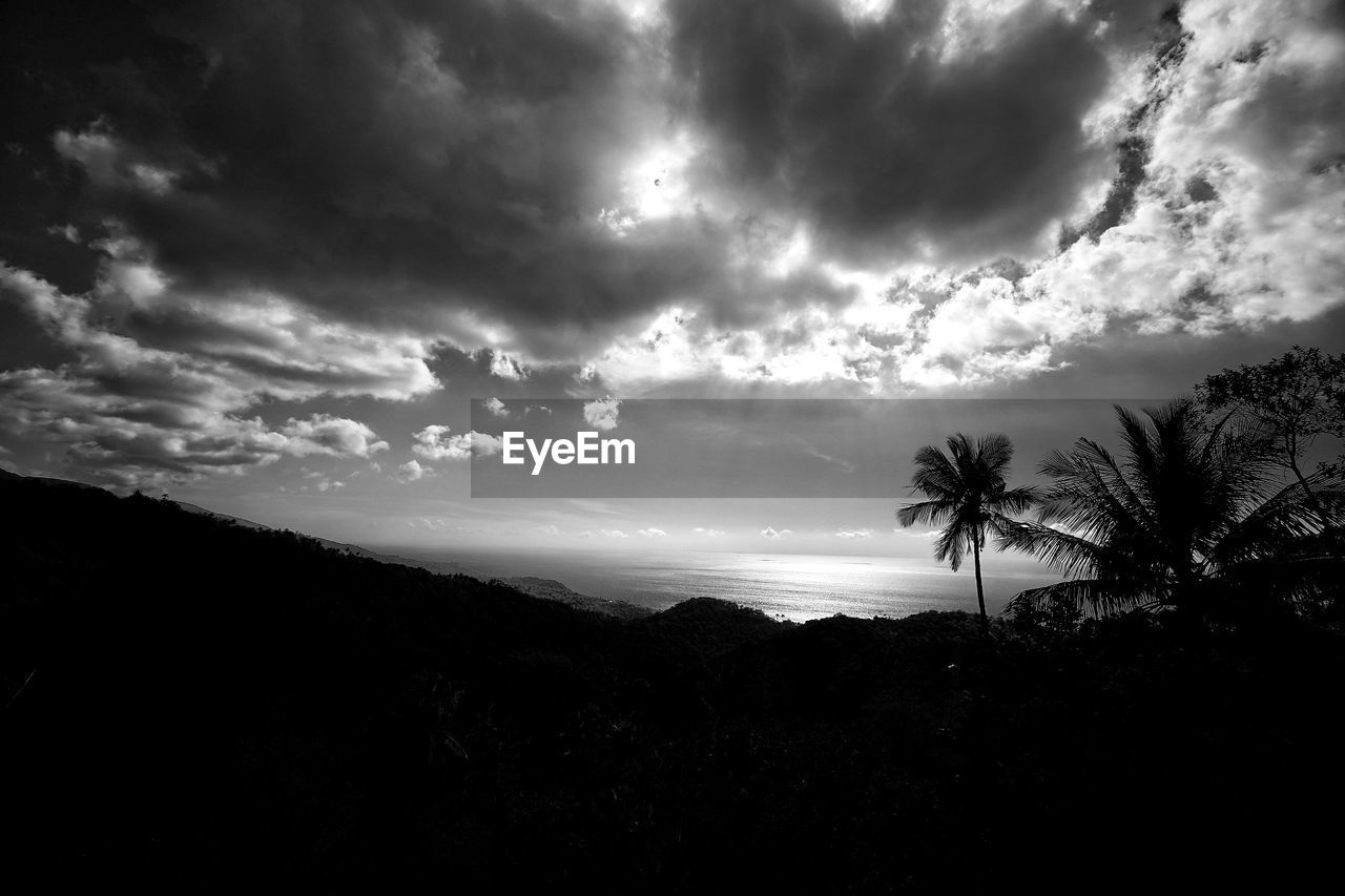 Scenic view of silhouette landscape against sky at dusk