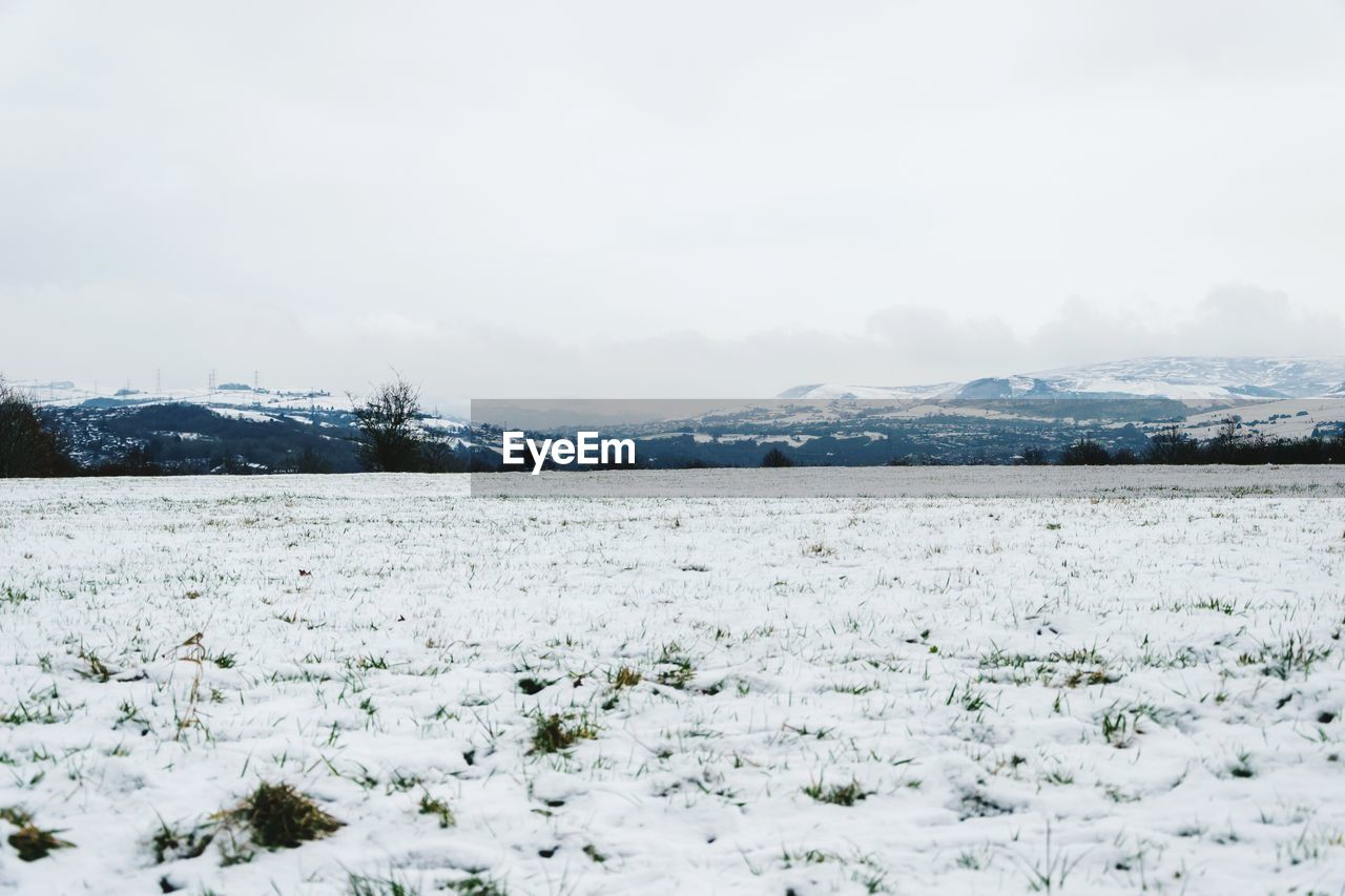 Scenic view of frozen lake against sky