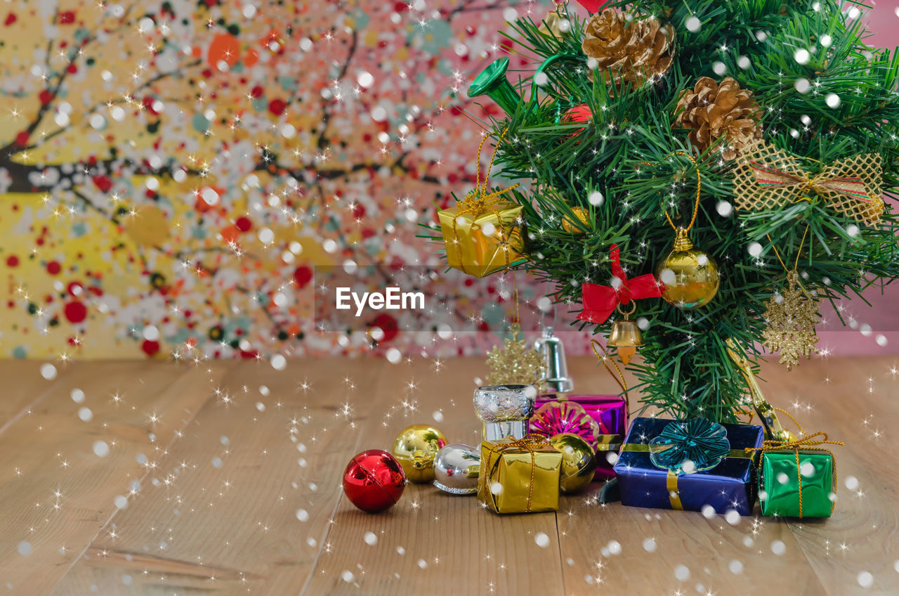 Gifts with christmas tree on floor 