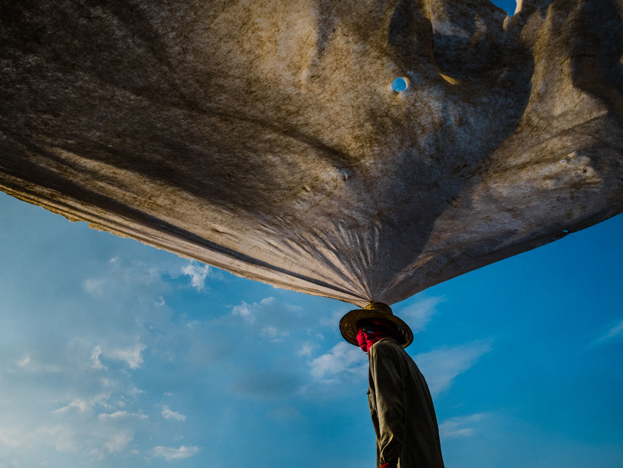 LOW ANGLE VIEW OF BALLOONS FLYING AGAINST BLUE SKY