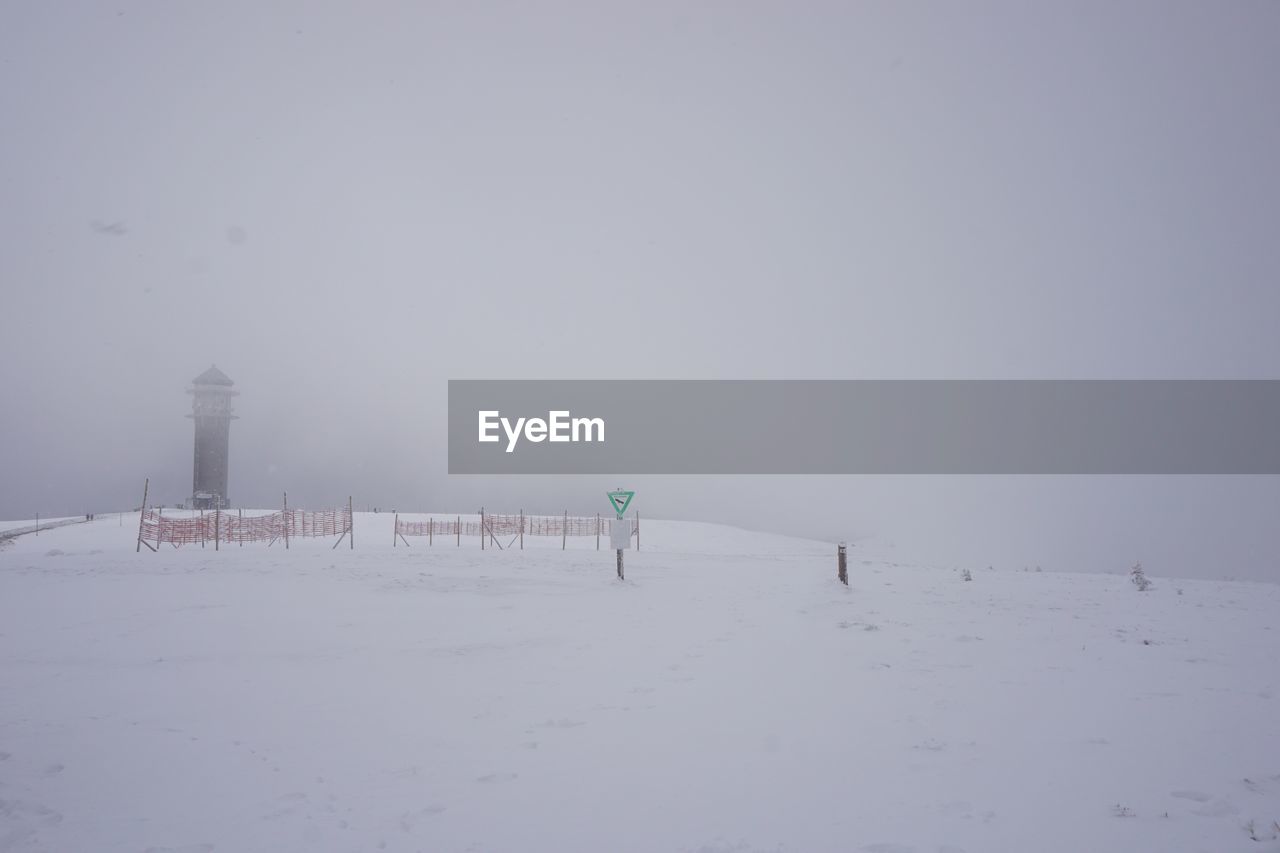 PEOPLE ON SNOW COVERED LANDSCAPE