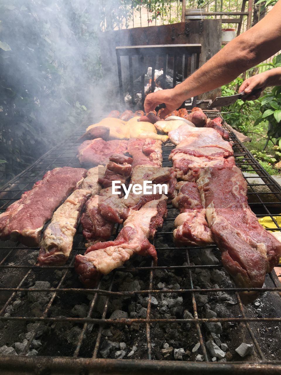 PERSON ON BARBECUE GRILL