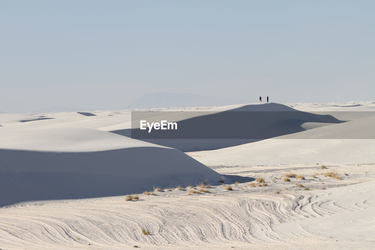 Couple on a dune in white sands national park