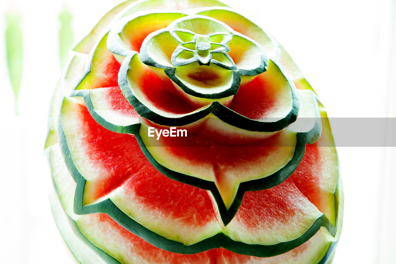 Design made on watermelon against white background