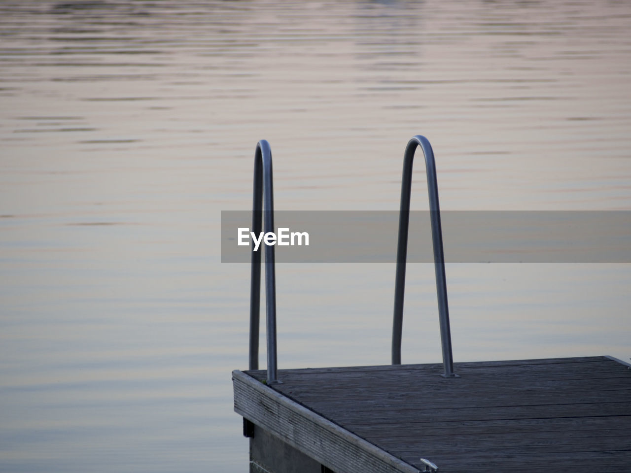 Close-up of pier over lake