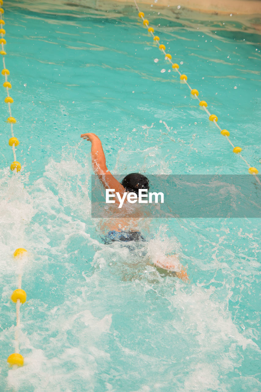 High angle view of athlete  swimming in pool