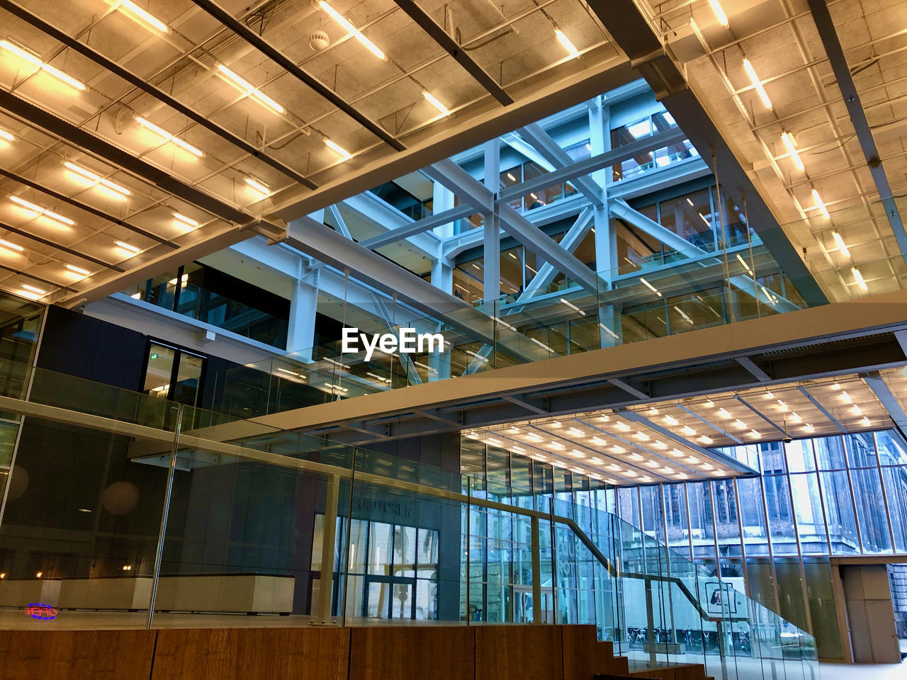 LOW ANGLE VIEW OF ILLUMINATED SKYLIGHT IN BUILDING