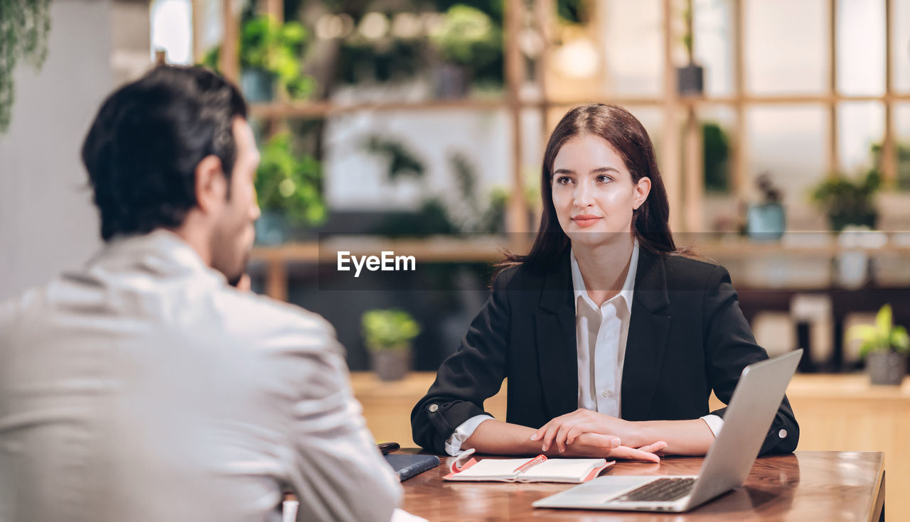 Lawyer women looking clint during advise at desk