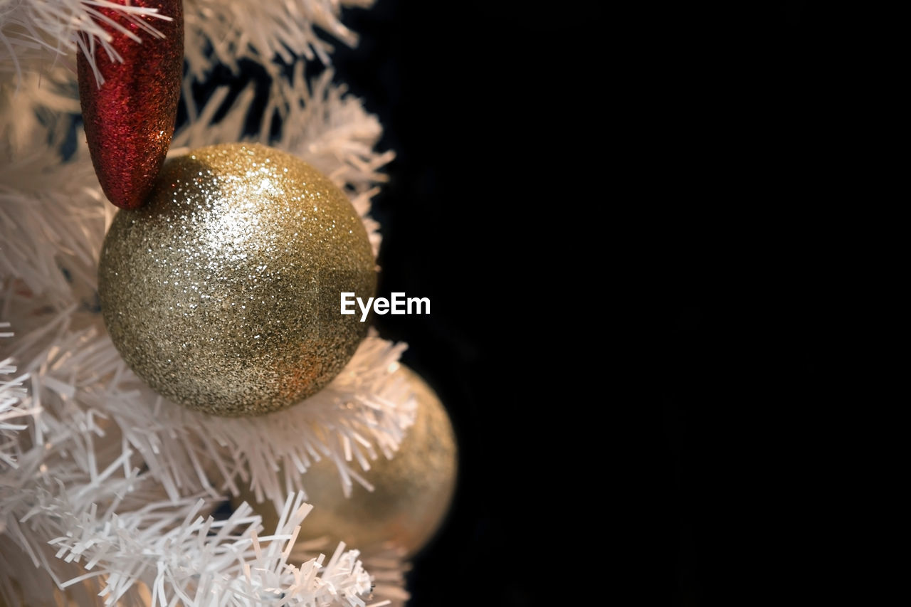 Close-up of christmas decoration against black background 