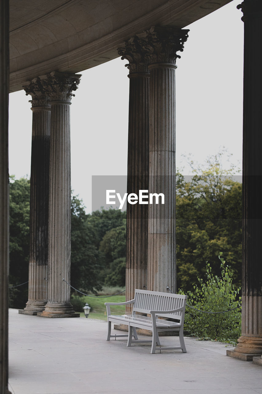 Empty chairs and tables against clear sky