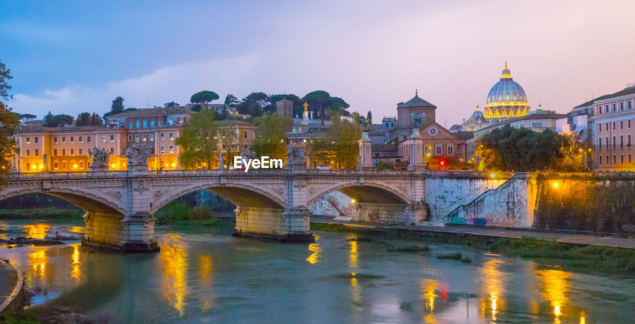 ARCH BRIDGE OVER RIVER IN CITY