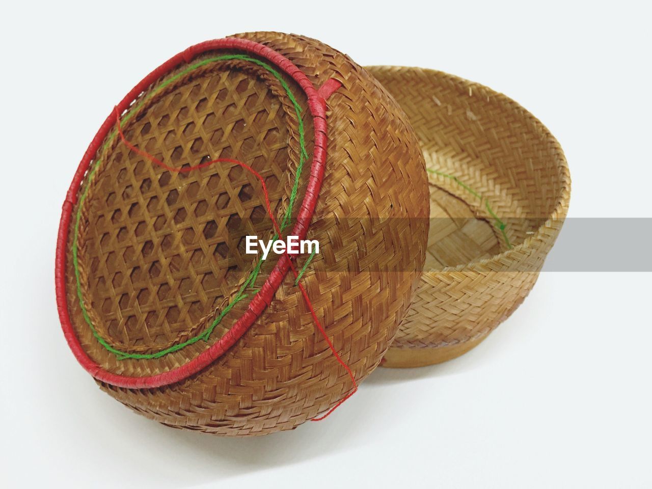 Close-up of wicker baskets on white background