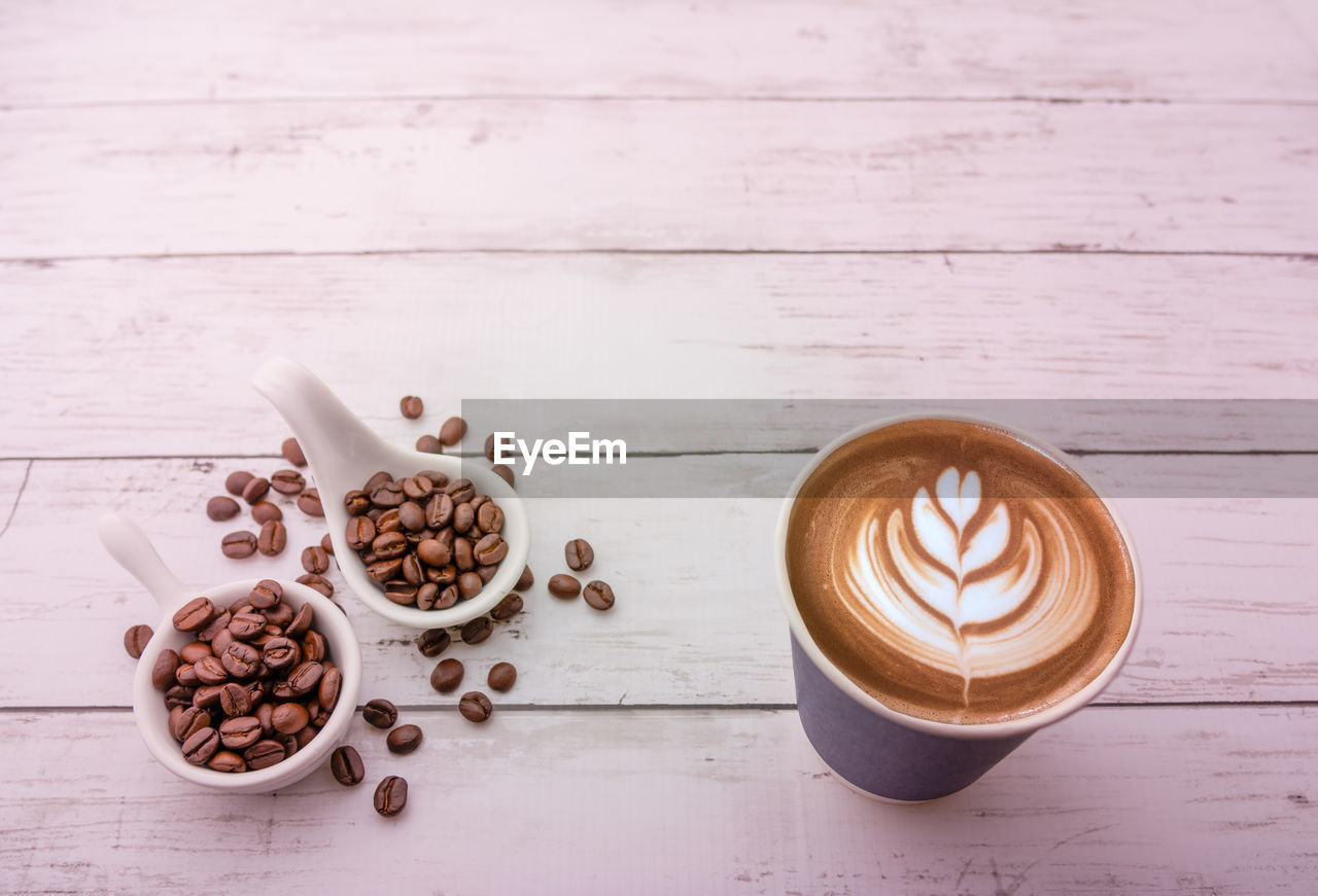 HIGH ANGLE VIEW OF COFFEE WITH CAPPUCCINO ON TABLE