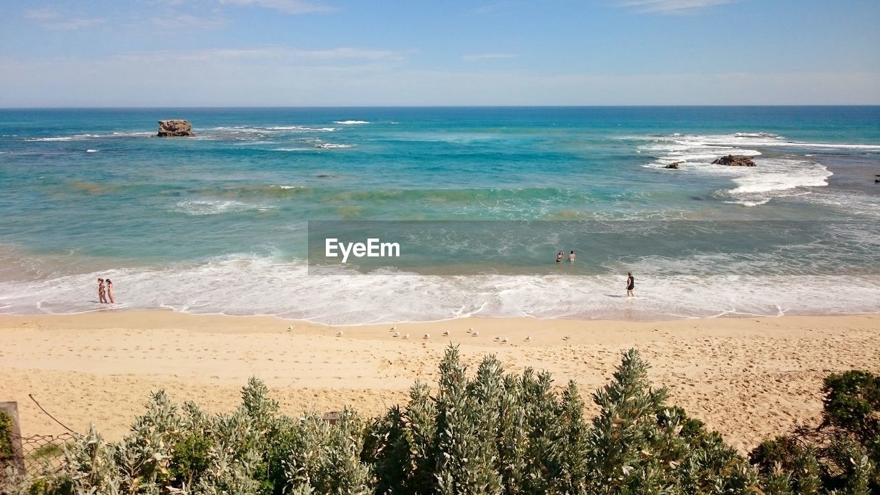 SCENIC VIEW OF SEA SHORE AGAINST SKY