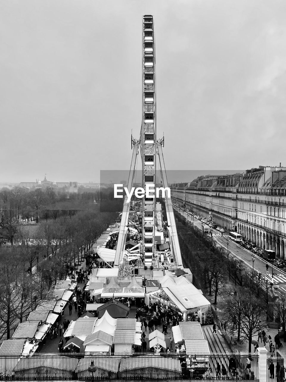High angle view of cityscape against sky - la grande roue - les tuileries paris. 