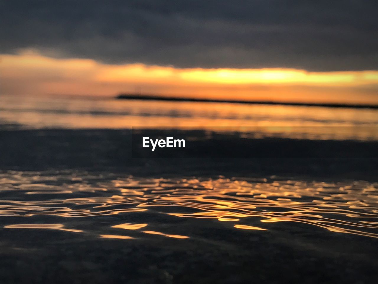 SCENIC VIEW OF SEA DURING SUNSET