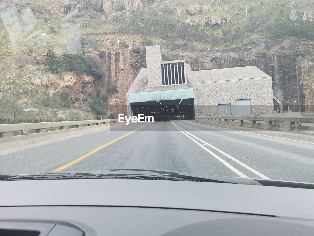 ROAD SEEN THROUGH CAR