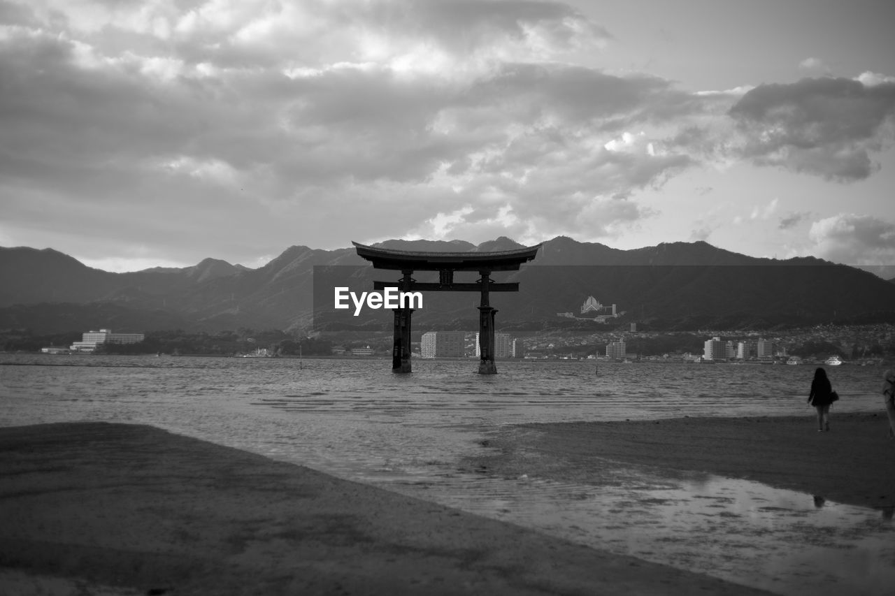 LIFEGUARD HUT AT BEACH AGAINST SKY