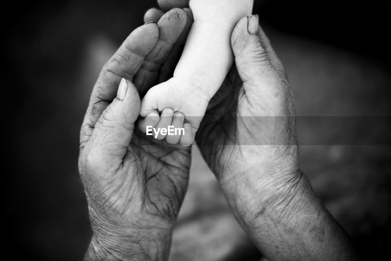 Youth and old age. hands of grandmother and granddaughter. high quality photo