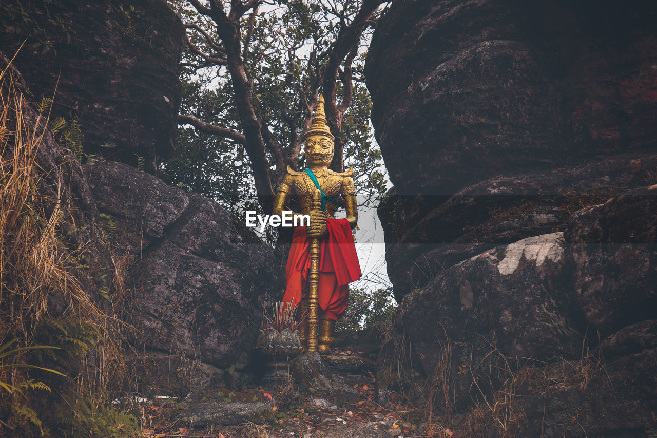 Golden buddhist statue in sampov pram pagoda in bokor national park in kampot cambodia