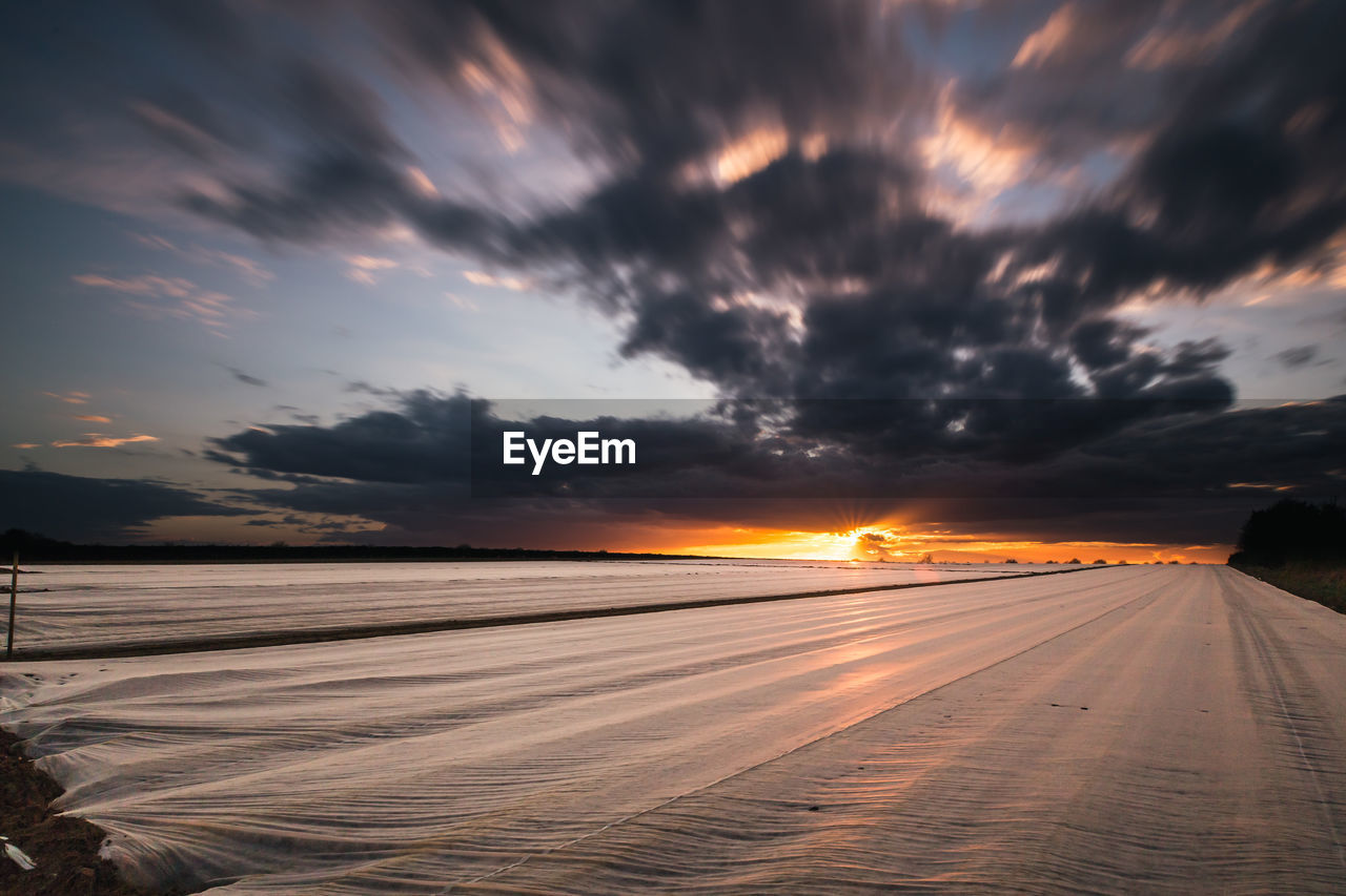 Scenic view of dramatic sky during sunset