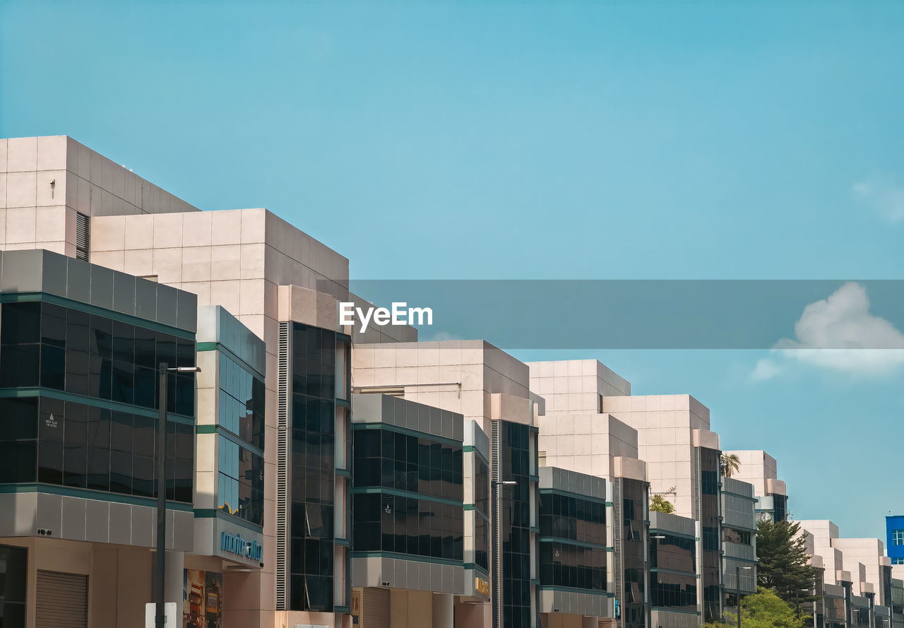 Low angle view of modern buildings against clear sky