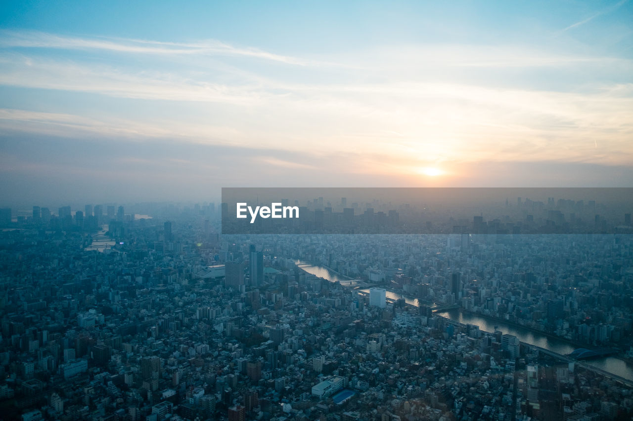 Aerial view of cityscape against sky