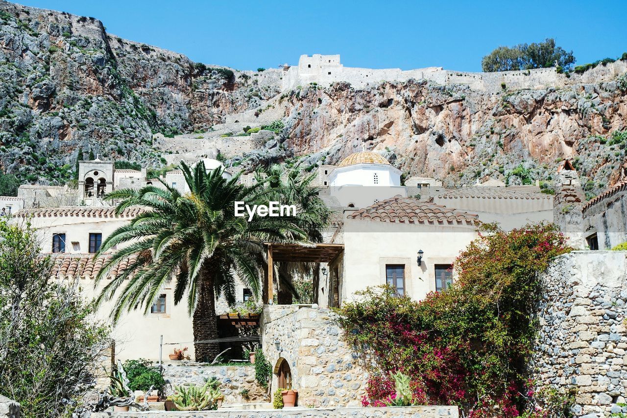 House against rocky mountain at monemvasia on sunny day