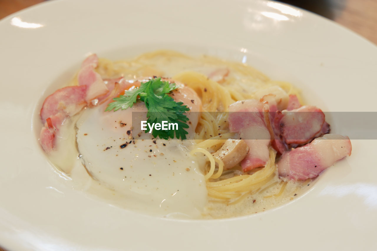 food and drink, food, dish, freshness, healthy eating, carbonara, indoors, wellbeing, cuisine, plate, close-up, meat, no people, meal, italian food, pasta, serving size, asian food, seafood, bowl, soup, table, restaurant, produce, garnish, herb, business, vegetable