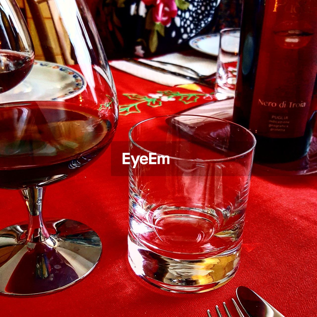 CLOSE-UP OF BEER GLASSES ON TABLE