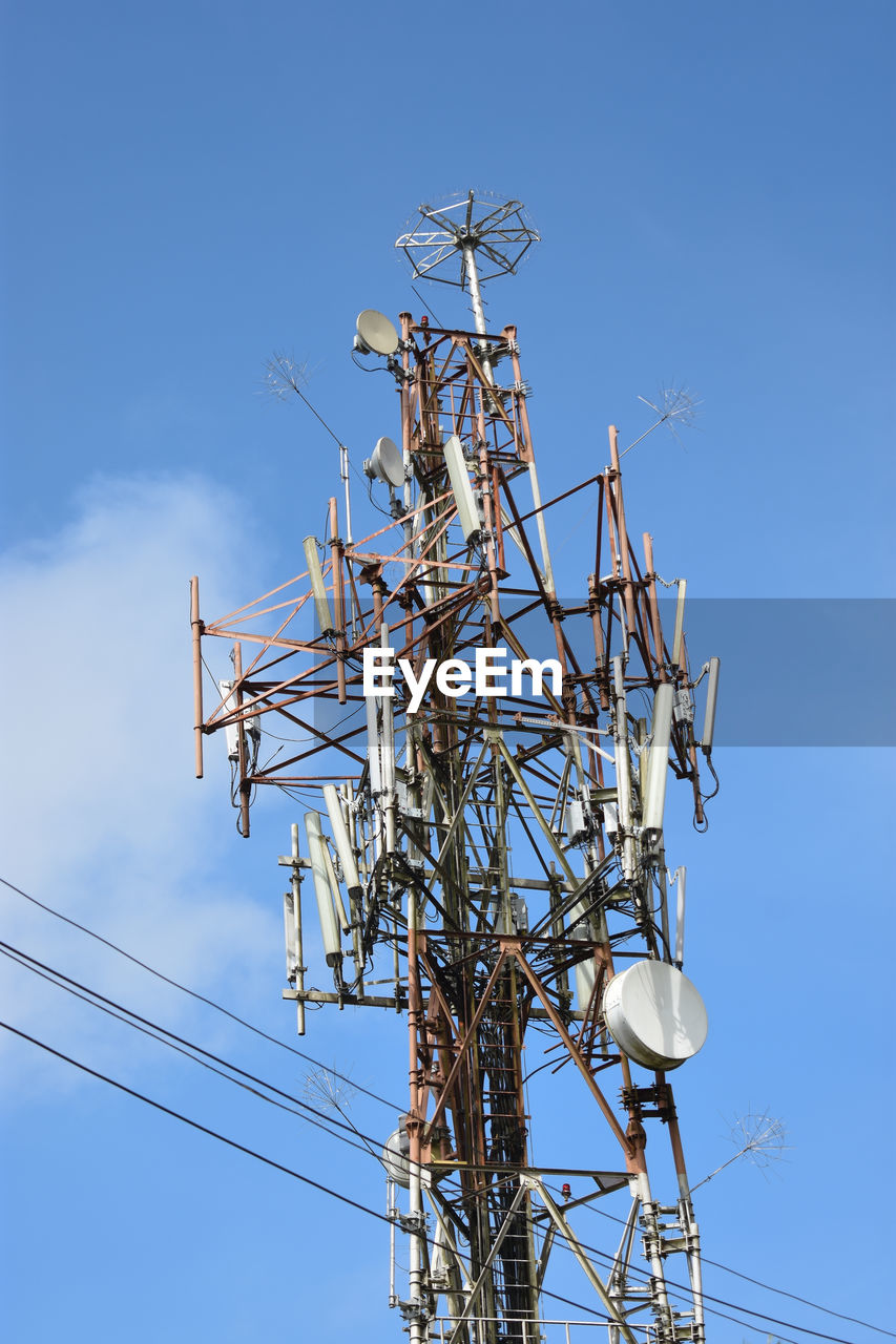 LOW ANGLE VIEW OF COMMUNICATIONS TOWER AGAINST SKY