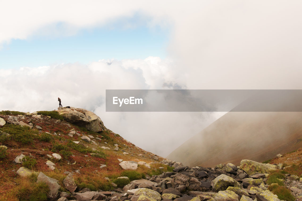 SCENIC VIEW OF ROCKS AGAINST SKY