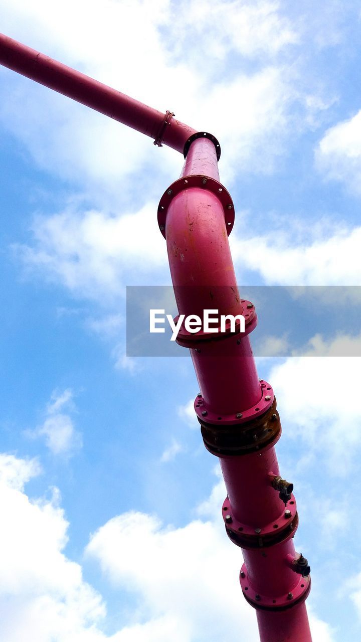 LOW ANGLE VIEW OF PINK LIGHT AGAINST BLUE SKY