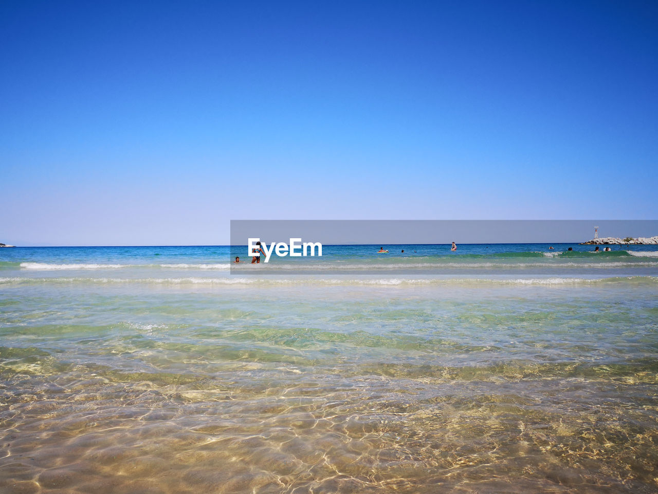 SCENIC VIEW OF BEACH AGAINST CLEAR SKY