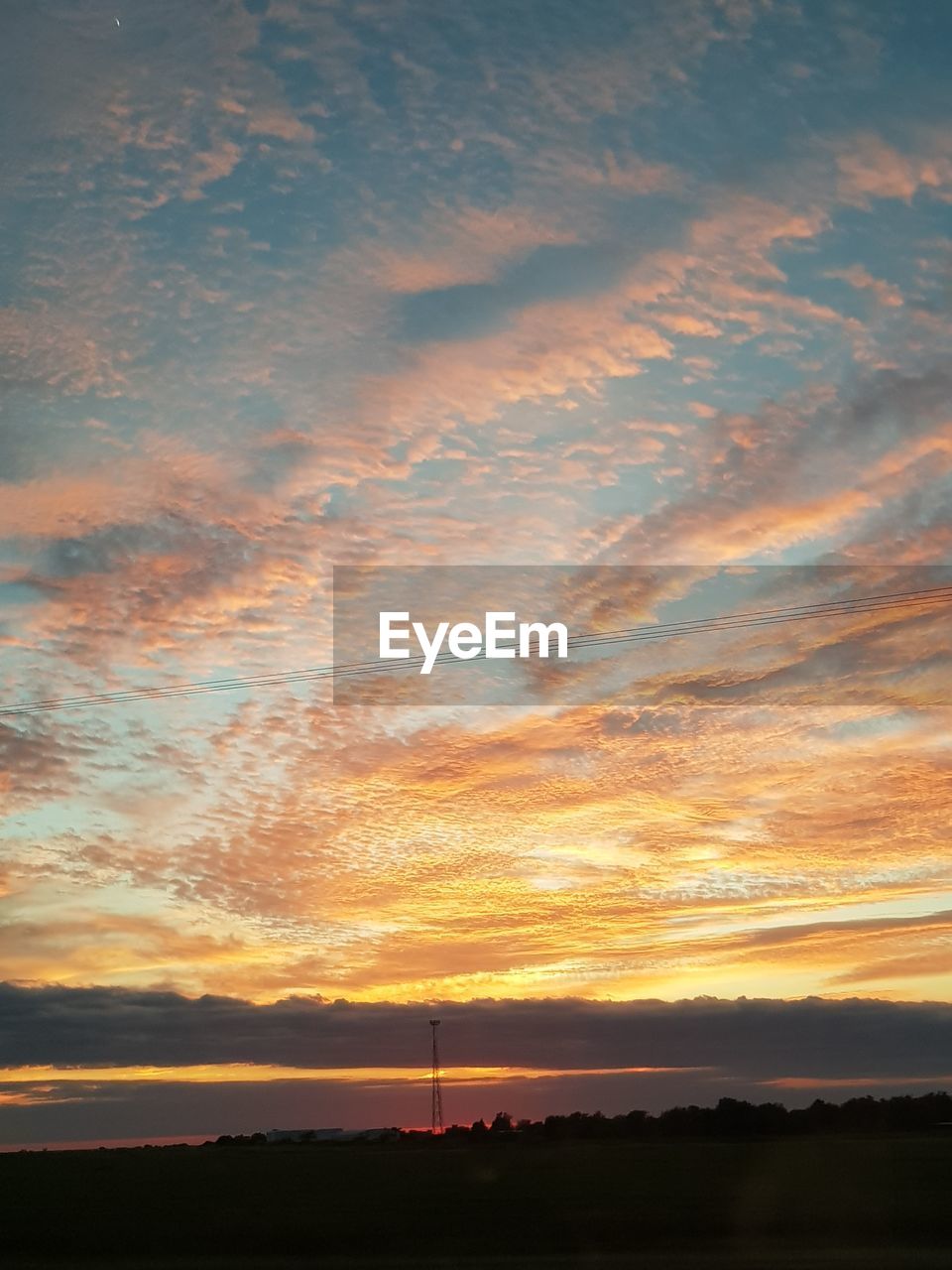 SCENIC VIEW OF DRAMATIC SKY DURING SUNSET