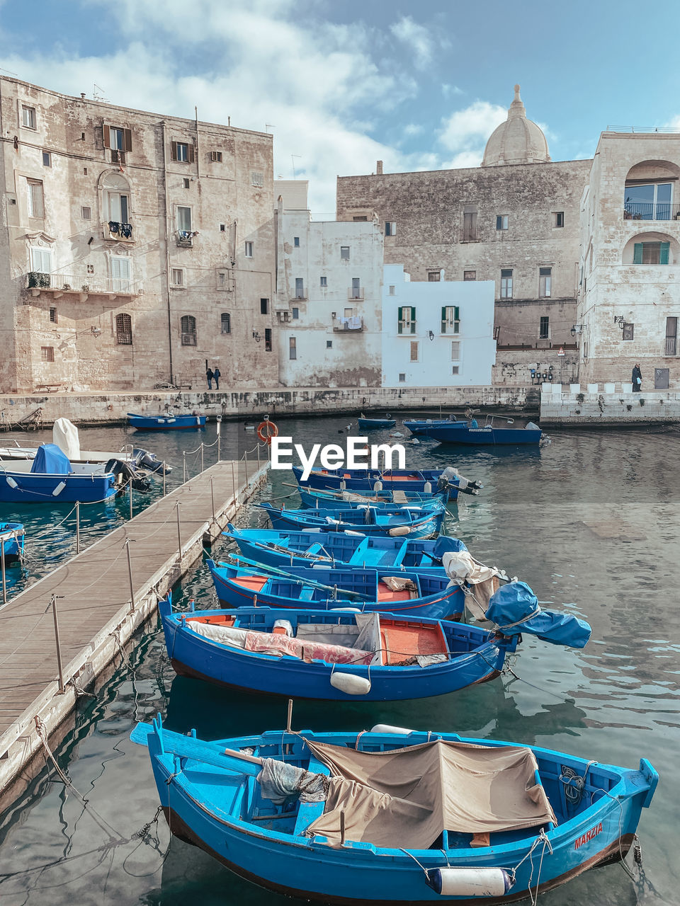 Boats moored at harbor