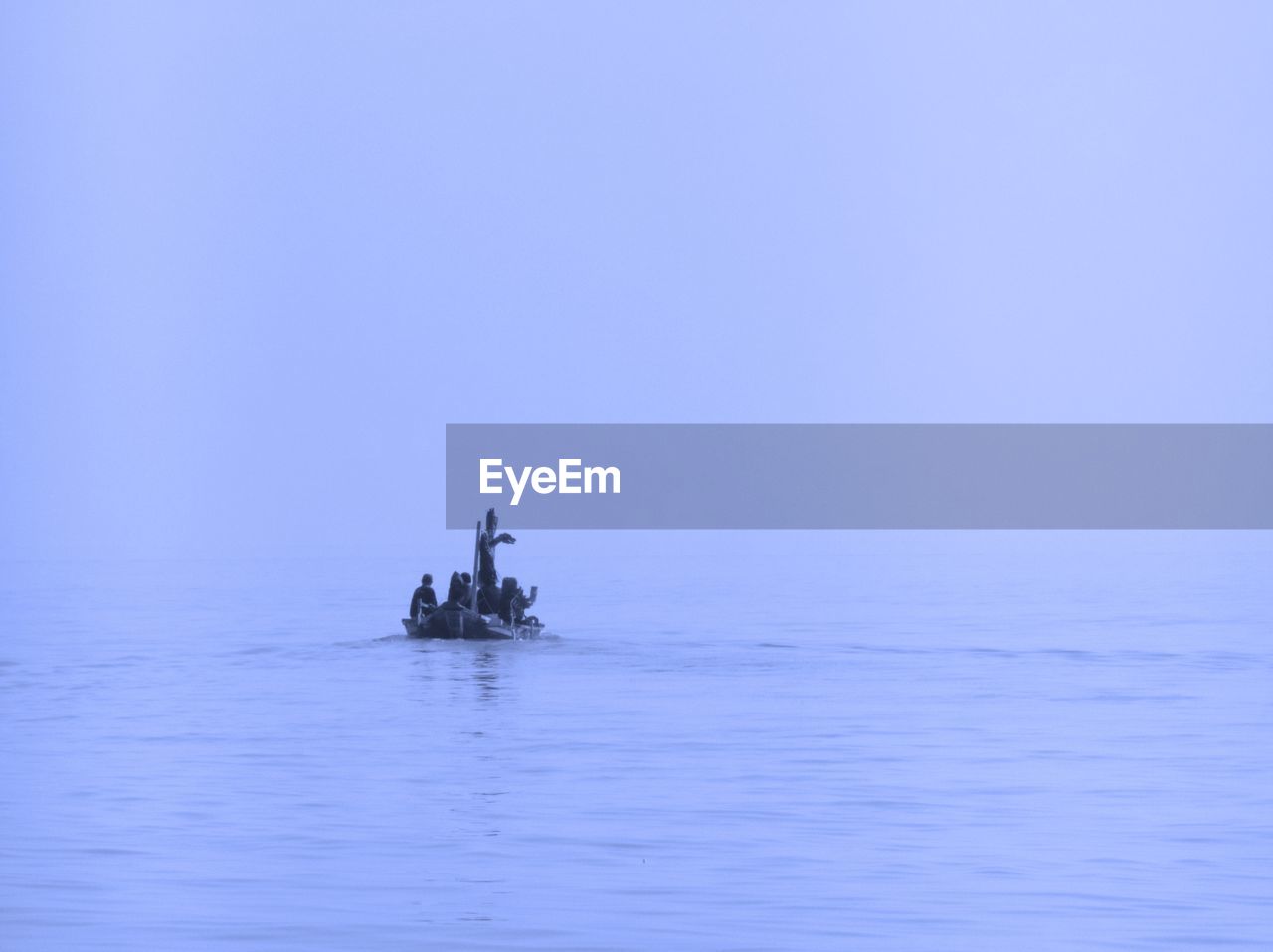 BOAT IN SEA AGAINST SKY