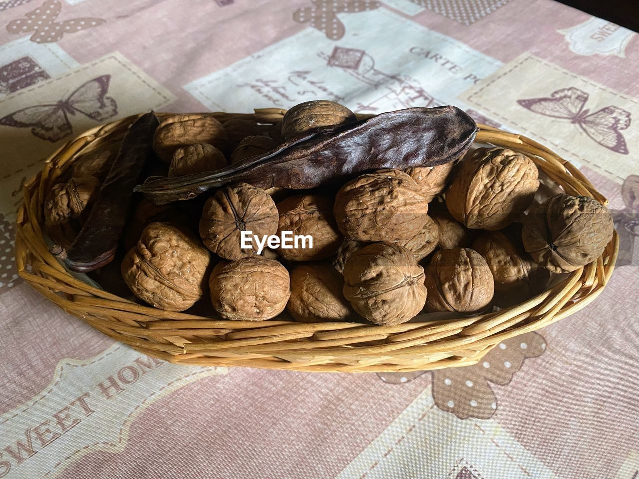 food and drink, food, basket, container, produce, freshness, still life, no people, indoors, high angle view, paper, healthy eating, wicker, wellbeing, table, close-up, nut