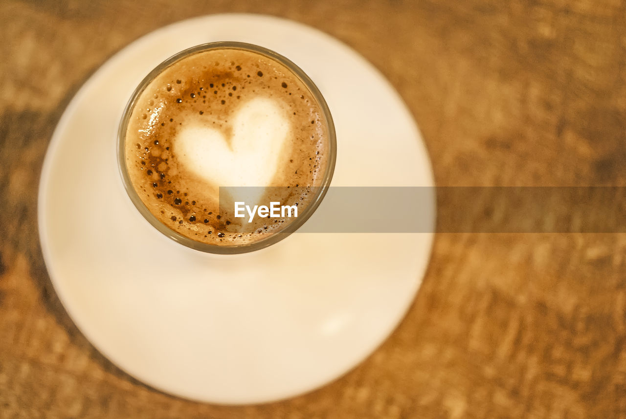 CLOSE-UP OF COFFEE CUP ON TABLE