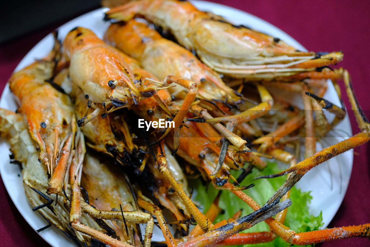 Grilled shrimp in a thai restaurant , high angle view of seafood in plate