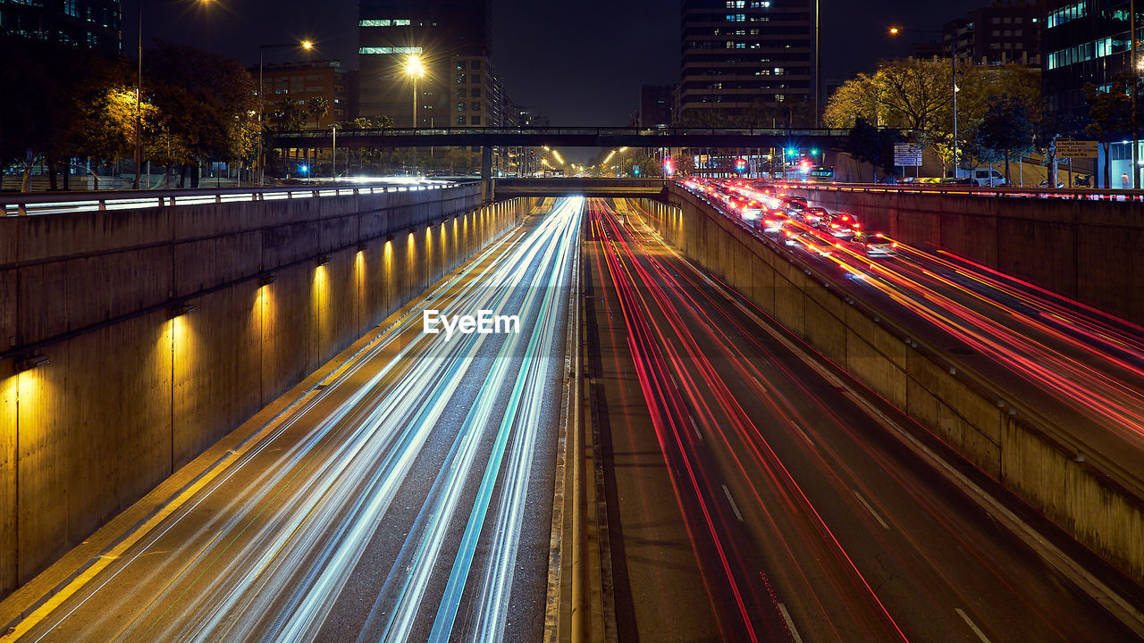 High angle view of light trails on road at night