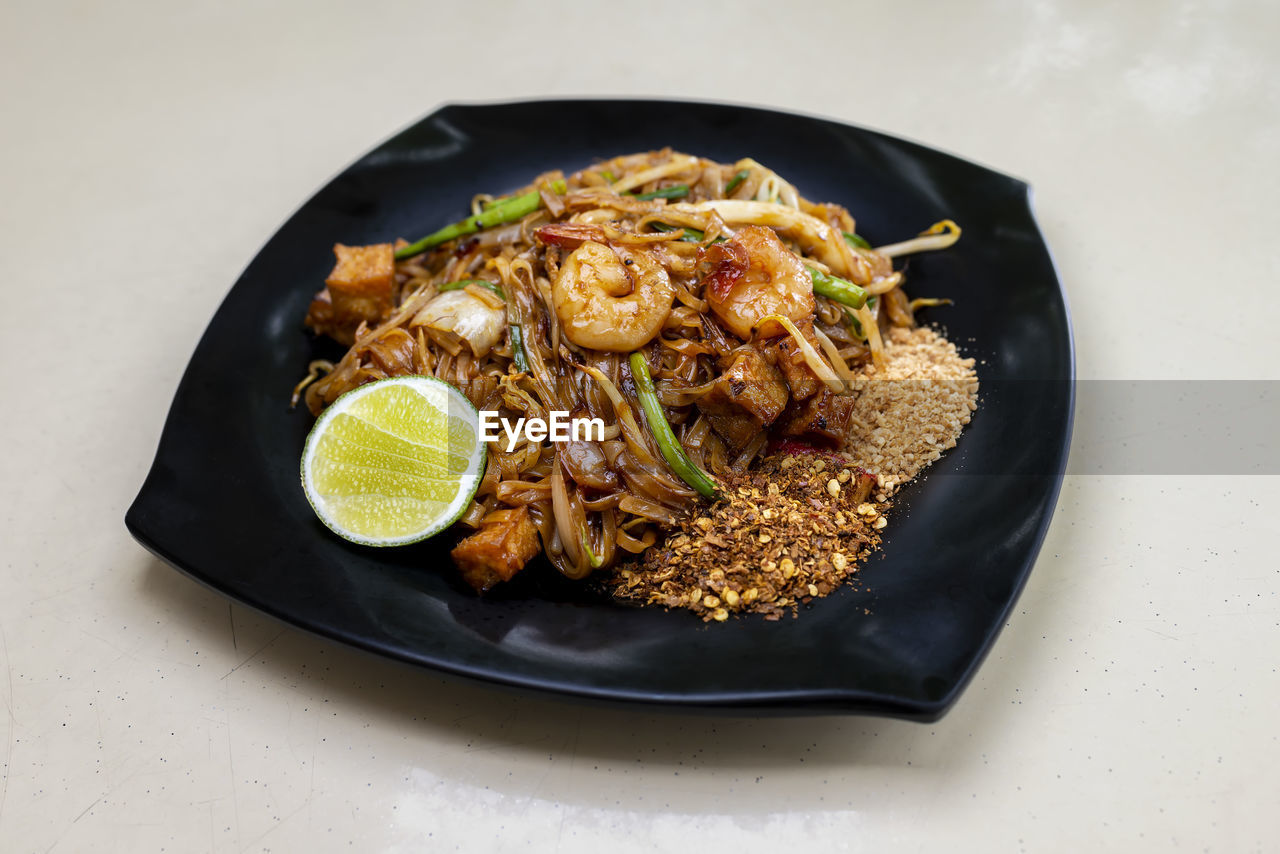High angle view of noodles in plate on table