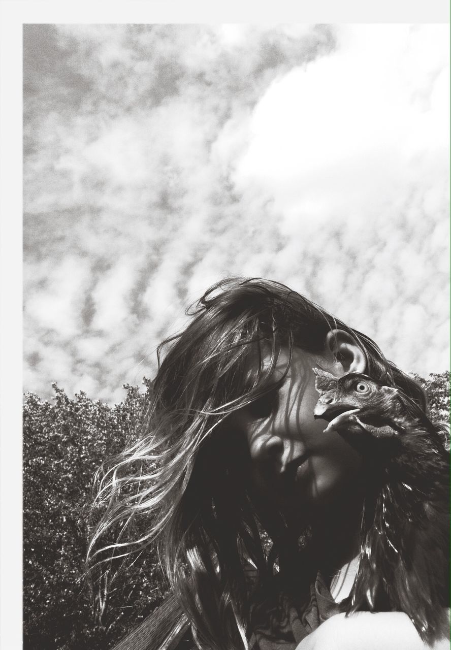 WOMAN LOOKING AT VIEW OF TREE